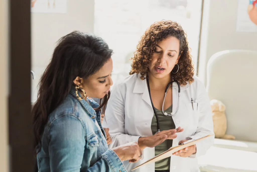 woman consulting a professional vein doctor about her chronic venous insufficiency